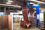 Once printed, fabrics are run through a mechanical dryer, which presses and sets all the layers of color in place. Marimekko's team then inspects and views each roll of textile by eye for any mistakes along process. Approved rolls are then shipped off to vendors and, in some cases, make their way onto any of the brand's myriad clothing items, products, or home accessories.  Photo 6 of 7 in For Marimekko's 
Artwork Studio Manager, 
Print's Not Dead