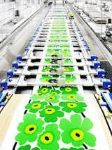 Once the screen printed graphic is finalized and approved by the creative and production teams, the pattern is printed onto cotton fabrics using long flatbed machines.  Photo 5 of 7 in For Marimekko's 
Artwork Studio Manager, 
Print's Not Dead