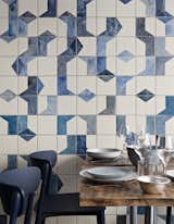 A closer look at the hand-painted, ceramic tile fresco on the ground level of Belle Maison. Bonaventure also specified ceramic dishes and tableware from Broste Copenhagen; the navy blue Nemea chairs are from Pedrali.