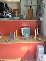 Good Thing's Slim bookends, Spiral trivet set, Paper Display, and Field candle holders sit side-by-side on the colorful display.