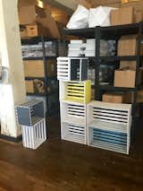 Prototypes of a modular shelving system that uses slats to stack without extra bulk.  