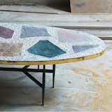Magic Stone coffee table, steel legs and mosaic top with brass, by Rooms

The mosaic top of Rooms's Magic Stone coffee table celebrates a range of materials by using oversize slabs. 