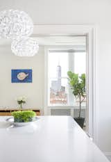 A view across the kitchen island south toward One World Trade Center. 

Photo by Howie Guja
Styling by Gorilla Styling