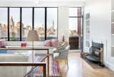 A wall of windows looks south to views of Lower Manhattan and One World Trade Center. To maintain some of the apartment's original charm, the architects at Fogarty Finger restored two original fireplaces.

Photo by Howie Guja
Styling by Gorilla Styling