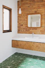 The residents chose the bathroom's Pikralida Green tiles from Tilenova in Sydney.