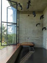 Study, Chair, Desk, Windows, and Metal Among the most dramatic spaces is the double-height office with sculptural installation.  Windows Chair Desk Photos from An Architect's Home and Studio Rises Above Rajagiriya