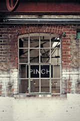 The exterior of the Pinch showroom and studio shows its industrial past.