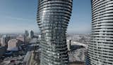 Located not far from Toronto, in Mississauga, Canada, Absolute Towers (2006–2012) is MAD Architects' statement on a new era of urban living. A landmark for the growing city, the towers feature an unusual twisting form, the result of floor plans rotated around the building's central core. This sinuous silhouette—where the spaces between buildings are as dynamic as the structures themselves—has earned the building the nickname the "Marilyn Monroe Towers."

Picture by Tom Arban