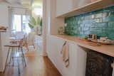 Kitchen, Ceramic Tile Backsplashe, and Wood Counter  Photos from A Barcelona Apartment Gets a Softly Modern Renovation