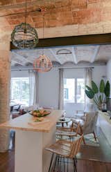 The open kitchen is the centerpiece of the renovated apartment. Bloomint designed the island.&nbsp;