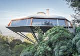 Chemosphere

7776 Torreyson Drive, Los Angeles

Cantilevered over the edge of a steep slope in the Hollywood Hills, John Lautner's 1960 creation has been compared to a flying saucer. The eight-sided house is supported by a concrete column, one of several ambitious technical decisions Lautner used to create this spectacular home. 

Photography by Darren Bradley
