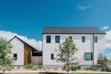 Outdoor At the back of the houses, cedar shingles provide an unexpected moment of visual interest.  Photo 2 of 7 in Sustainability is the Centerpiece of This New Austin Development