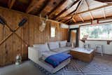 Though brightening the house was a top priority, the couple kept the original cedar cladding and raw redwood ceiling in the guest house as a nod to the home's original style.
