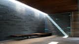 Live edge bench at lava wall entry  Photo 1 of 2 in Minimalist by Kulia