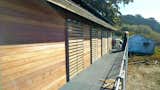 Sliding steel and wood shutters installed on the house exterior
