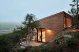 On a scenic one-acre site in Inverness, California, Richardson Architects planted an artist studio in a hillside overlooking a coastal vista. The client, a painter who lives on the property, requested the addition be situated downhill from the main residence to create distance between work and home.