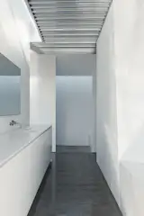 In the master bath, a Boffi tap pairs with a Kohler sink.