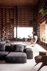 #library #sectional #bookshelves #reading #relaxing #storagegoals Photo by Jonas Bjerre-Poulsen  Photo 9 of 15 in The Olympics Might Be Over, But This Brazilian Penthouse Is a Winner by Matthew Keeshin
