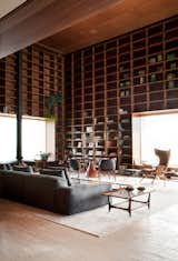 #library #sectional #bookshelves #reading #relaxing #storagegoals Photo by Jonas Bjerre-Poulsen  Photo 13 of 15 in The Olympics Might Be Over, But This Brazilian Penthouse Is a Winner by Matthew Keeshin