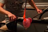 To make the tail, another drop of hot glass is added and cut.