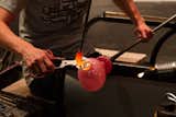 To form the bird's head, glassmaker Helena Welling then adds a drop of molten glass to its body.