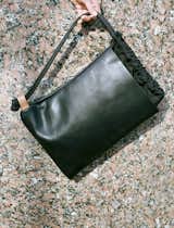 The #Dossier is the product of a slow evolution of a rudimentary #drawstringbag. The Dossier features a main body of 3mm black #horween leather, with ballistic #nylon #drawstring closure. The handle/strap is made from a single piece of black static climbing rope that passes through a small 5mm vegetable tan #leather loop. The Dossier Sac keeps its sharp #geometric shape even when the drawstring is pulled tight because of its unique top closure. #design #bag #leatherbag #knaufandbrown #fashion #sac
