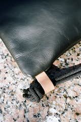 The #Dossier is the product of a slow evolution of a rudimentary #drawstringbag. The Dossier features a main body of 3mm black #horween leather, with ballistic #nylon #drawstring closure. The handle/strap is made from a single piece of black static climbing rope that passes through a small 5mm vegetable tan #leather loop. The Dossier Sac keeps its sharp #geometric shape even when the drawstring is pulled tight because of its unique top closure. #design #bag #leatherbag #knaufandbrown #fashion #sac
