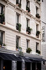 The neo-classical building that houses Le Pigalle is done in the local Parisian style known as La Nouvelle Athènes and features conic moldings and friezes. The neon signs that adorn the exterior reference the frequent use of neon throughout the Pigalle neighborhood.&nbsp;