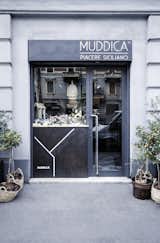 Previously a tailor’s shop located in the heart of Milan, Muddica has been converted into a restaurant, bar, and Sicilian deli. &nbsp;