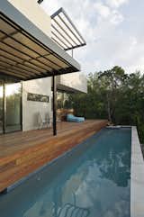 #CarvedCubeHouse #residence #perfectcube #modern #midcentury #levels #exterior #outdoor #outside #lanscape #deck #pool #view #axis #Texas #BercyChenStudio  Photo 5 of 11 in Carved Cube House by Bercy Chen Studio