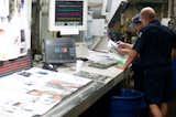 The crew keeps a close eye not only on the controls, but also on the pages by pulling samples from the line frequently.  Consulting one another is key to keeping an eye on quality. 