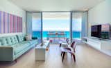 #modern #architecture #modernarchitecture #apartment #renovation #minimal #colorful #living room #balcony #view #ocean #coveredpatio #DENArchitecture #Brazil
