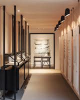 Curated Properties is a minimal sales center located in Toronto, Canada, designed by Mason. Curated Properties is a condominium sales center developed within disused industrial shipping containers. The naturally linear form of the shipping containers lend to a systematic procession through the sales center allowing the sales team to narrate the story of the product to the purchasers in a guided manner. Interior finishes and details are to reflect the temporary nature of the sales center and to embody the spirit of the project’s identity. Unfinished plywood, raw metals, canvas, and untanned leathers are used in methods to reflect detailing of traditional retail environments. The pairing of unrefined materials with quality handmade local furniture, millwork and custom artwork creates a backdrop to the sale experience.