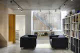 Living Room, Sofa, Concrete Floor, Bookcase, and Track Lighting  Photos from Godson St by Edgley Design