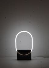 The Voie light series is a minimal light design created by Rotterdam-based designer Sabrine Marcellis. Having chosen neon as the primary light source, the designed objects create an interception on the path the light follows through the addition of a singular extra material. The addition of cast polyester resin diffuses the light path and in turn uses the light source to enhance the color properties within the resin. A new moment is created when this mutually beneficial relationship is formed between materials, defining the unique properties of each where the two meet.