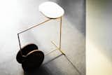 Elegant is a minimal side table created by China-based designers Tells Design Studio. The side table is characterized by walnut wheels that allow the table to easily and freely move from one room to the next. Premium materials were chosen, including brass from the frame, walnut for the wheels, and marble for the surface. When not in use, the side table resembles that of a sculpture, and is a beautiful statement piece for the modern home.