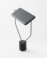 Lloyd is a minimal lamp created by Vancouver-based designers Knauf and Brown. Lloyd is a desk light that rotates 360 degrees at both its base and its shade. The large LED panel can be positioned to allow its soft, diffused light to be directed anywhere. An angular length of steel, gently sunk into the pedestal base, secures the shade and provides a strong visual presence that contrasts its minimal silhouette.  Photo 1 of 188 in Products by Leibal