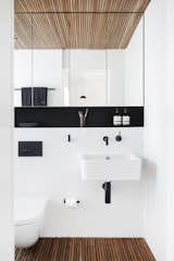Bath Room, Wall Mount Sink, and Medium Hardwood Floor  Photo 8 of 14 in Home by JASON GETHIN from Nano Pad