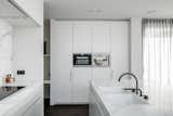 Kitchen, Marble Counter, Marble Backsplashe, Recessed Lighting, and Wall Oven  Photo 8 of 17 in Penthouse O by Leibal