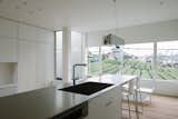 Kitchen, Light Hardwood Floor, Granite Counter, and Recessed Lighting  Photo 1 of 22 in Vida by Leibal