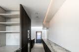 Kitchen, Marble Counter, Light Hardwood Floor, Ceiling Lighting, and Wall Oven  Photo 4 of 6 in Circu House by Leibal