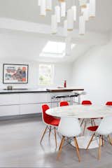 Kitchen, Granite Counter, White Cabinet, Light Hardwood Floor, and Pendant Lighting  Photos from Maida Vale Apartment
