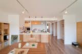 Kitchen, White Cabinet, and Medium Hardwood Floor  Photo 4 of 10 in Book Cafe House by Leibal