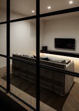 Living Room, Sofa, Dark Hardwood Floor, and Recessed Lighting  Photo 5 of 22 in Residence in Takariya by Leibal