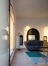 Living Room, Terrazzo Floor, Chair, and Floor Lighting  Search “bathfloors--terrazzo” from Old Jaffa House