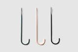 Bite is a minimalist coat hook created by Zurich-based designer Mario Zoller. Bite is a simple, hand-forged coat hook. Inspired by the shapes of traditional fishing hooks, Bite combines simple design with thoughtful details. The hook is mounted directly on the wall. The washer and the small rubber ring ensure that the hook can not rub against the wall when hanging clothes. Bite is available in three colors: black, dark green and apricot.