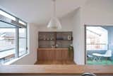 Kitchen, Wood Counter, Wood Cabinet, Light Hardwood Floor, and Ceiling Lighting  Photo 10 of 16 in Nakamama Base by Leibal