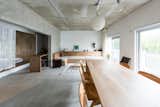 Hamadayama House is a minimal renovation located in Suginami, Japan, designed by moyadesign. The renovation is of a 40-year old low-rise apartment building that was once occupied by offices. The building faces a private road and garden to the north and south, and is surrounded by a quiet environment. The one-room visually connected was gently divided into three public, private, and semi-private spaces by the hanging walls using the existing concrete wall. It is also possible to make partitions in the future using this wall.