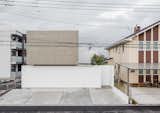 Slide Block is a minimal architecture project located in Tsukuba, Japan, designed by Kichi Architectural Design. The second floor volume protrudes, it seems to float in the air. Because it is a very simple facade, pedestrians can not imagine inside. The living room and dining room on the first floor are a space without walls. One can look at the courtyard surrounded by high walls when you are in the first floor room. One can enjoy a meal casually in the spacious terrace with a roof along the dining room.