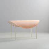 Tack Bench is a minimal bench created by Vancouver-based designers Knauf and Brown. The tack bench takes its form from equestrian accoutrement. The seat is a curved steel surface softened by a thick vegetable tan leather oval with a nod to the shape of a saddle. The curved seat drapes over four slender steel legs with non marking rubber feet.